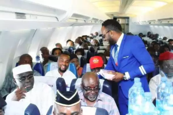 Photos: Singer Kcee Surprises Passengers On Air Peace Flight By Serving Them
